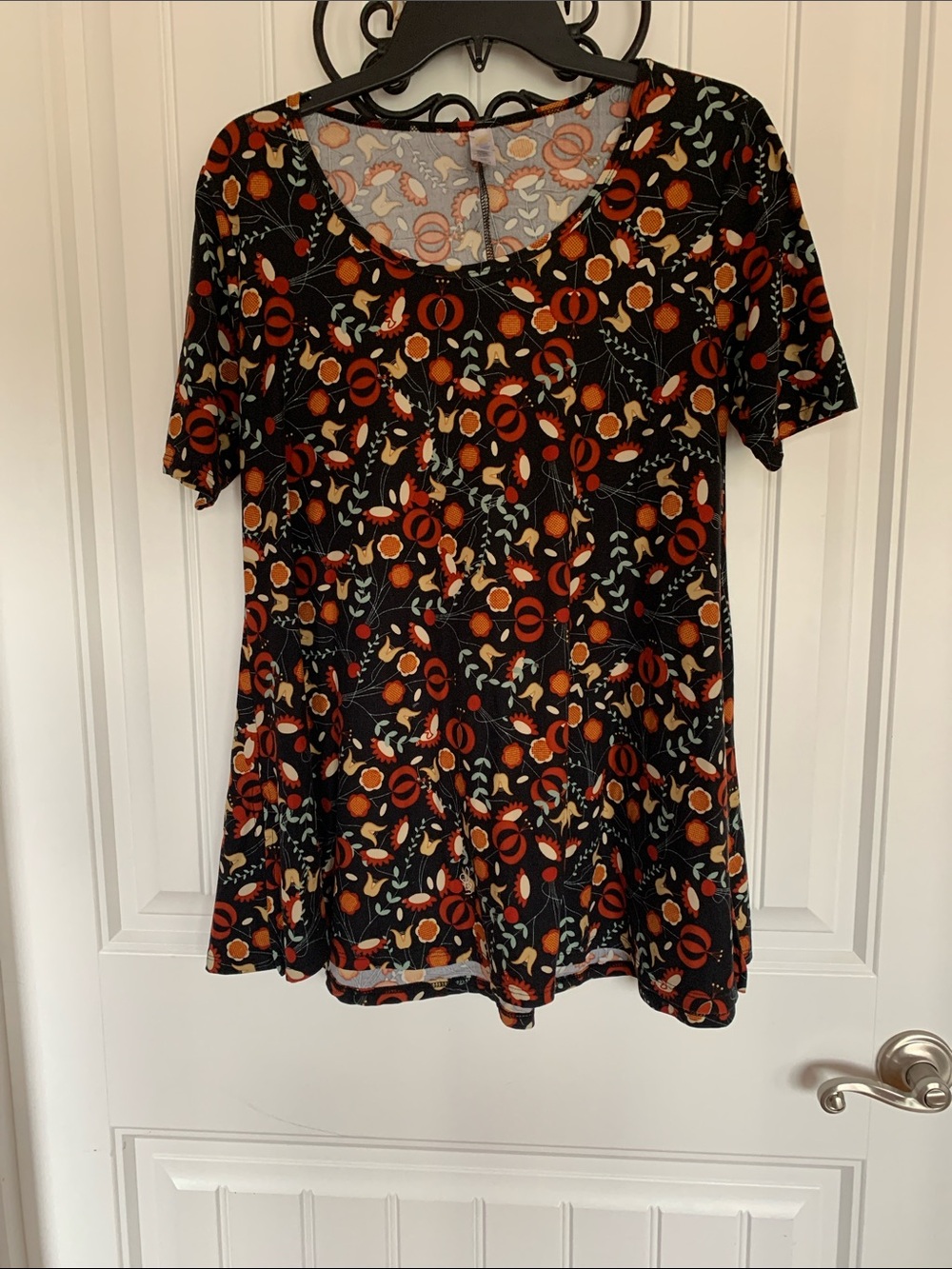 LuLaRoe Black Short-Sleeve Floral Swing Top with Orange Accents